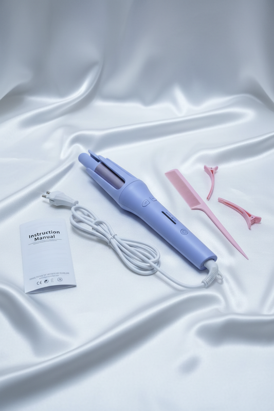 Rizador con cable normal sobre sábana blanca